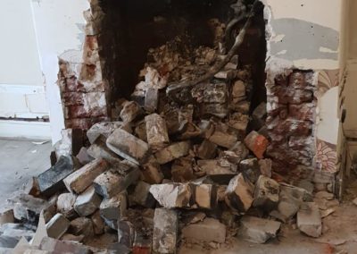 Image of incomplete fireplace with bricks